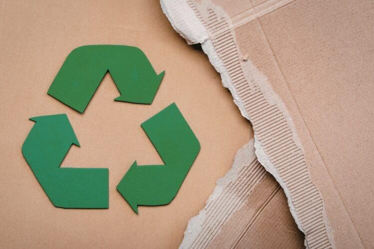 Recycling symbol on sustainable cardboard packaging materials.