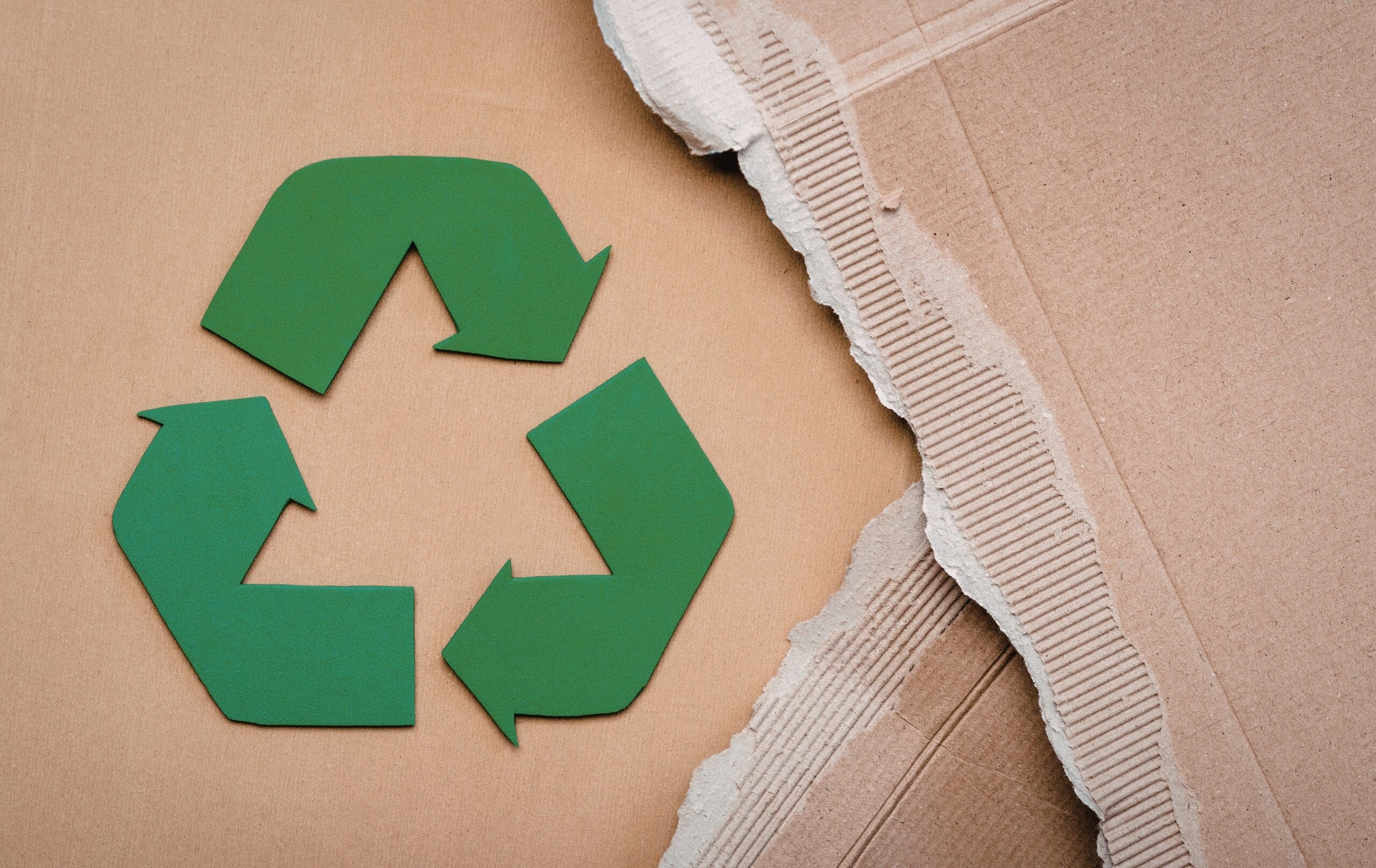 Recycling symbol on sustainable cardboard packaging materials.
