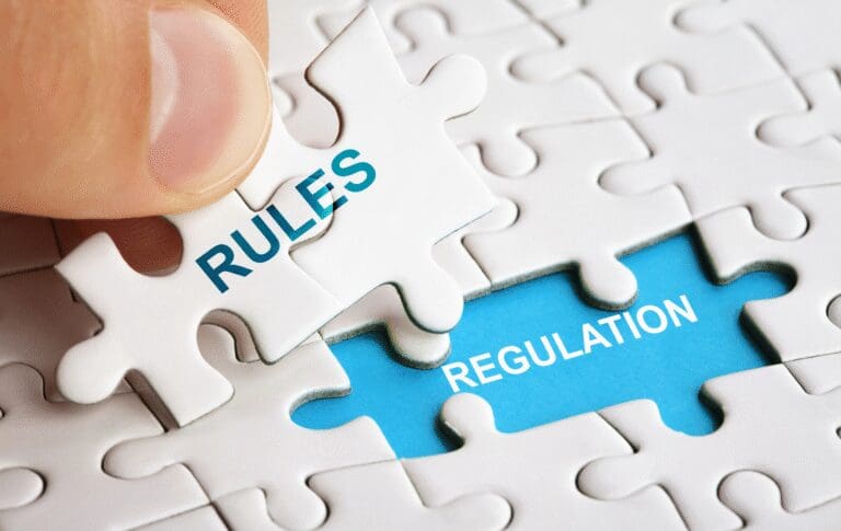 Puzzle pieces illustrating the connection between regulatory rules and compliance regulations.