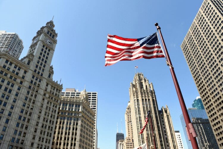 United States flag displayed among city skyscrapers representing the US cosmetic market