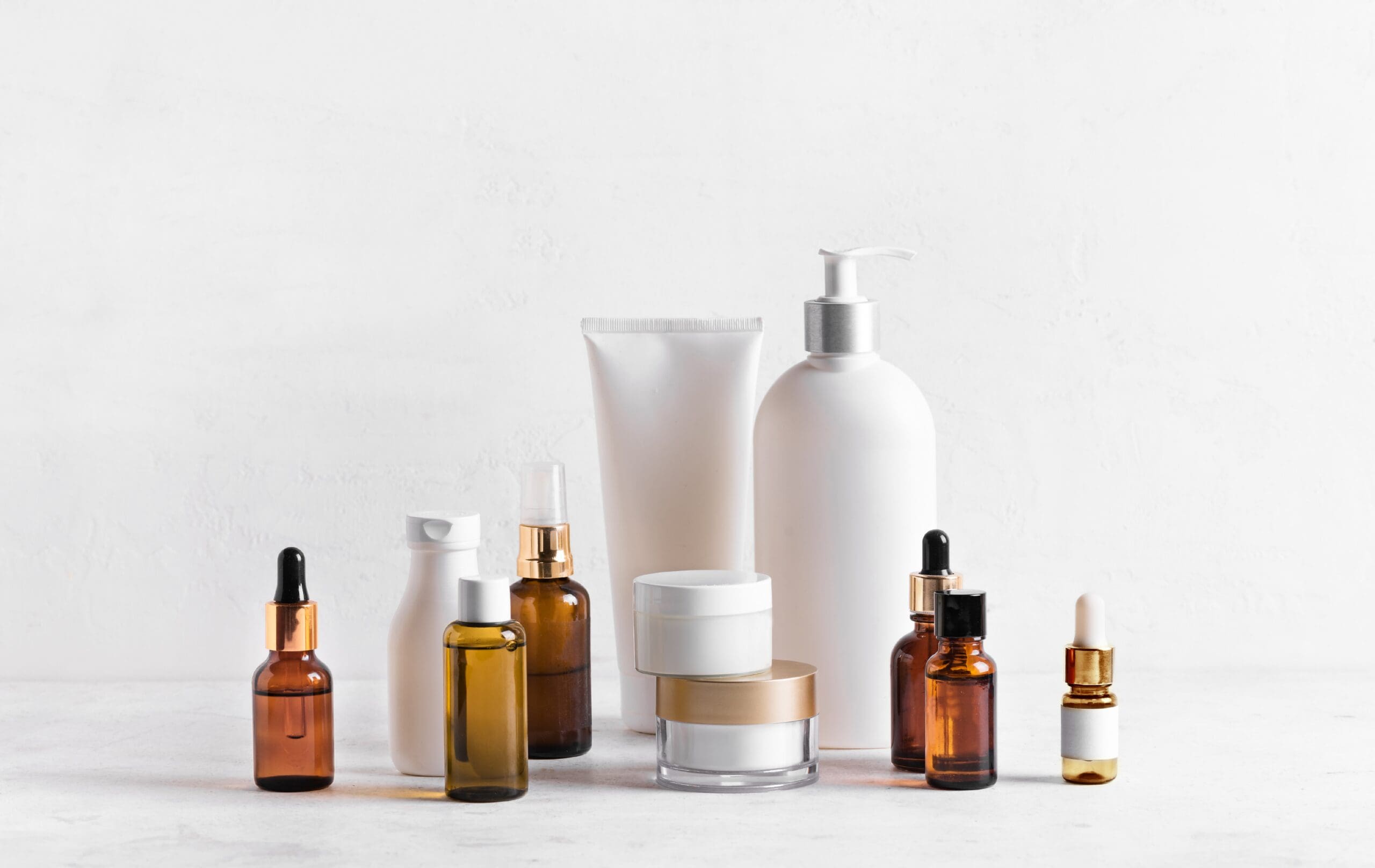 Selection of skincare cosmetic products including creams, serums, oils and lotions.