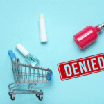 Cosmetic products and shopping cart beside a denied stamp representing market access restrictions.